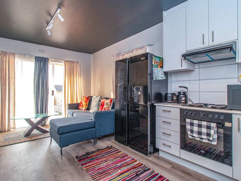 A modern two-bedroom apartment where comfort, convenience, and natural beauty come together. - Photo 2