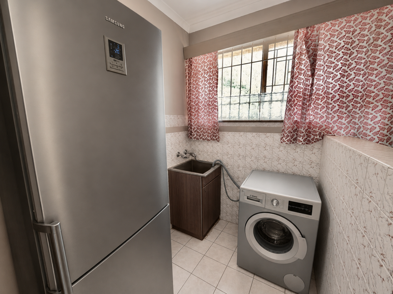 Functional laundry area featuring a stainless steel utility sink, tiled splashback, and dedicated space for a washing machine.