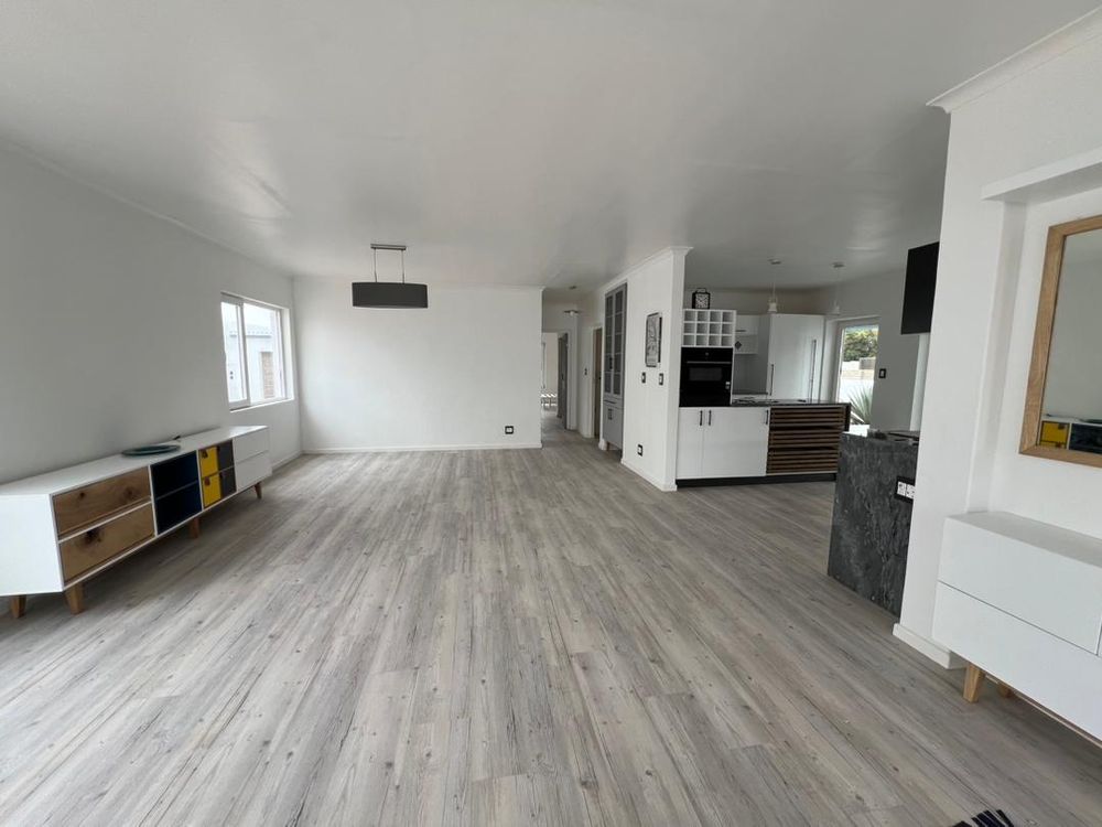 Open-plan kitchen, lounge and dining room upon entry