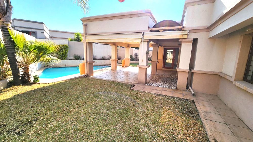 View to entertainment and pool area from master bedroom.