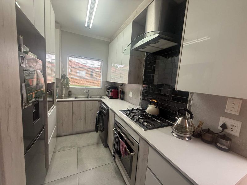 Modern, Move-In Ready Home with Solar – Secure Complex Living at Its Best! - Photo 2