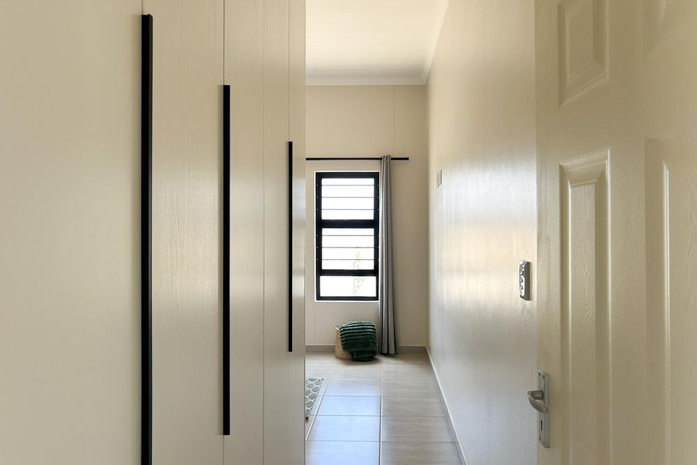 Plenty of cupboards in main bedroom.