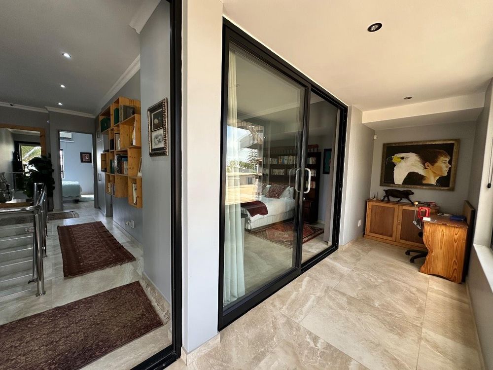 First floor with spare room and hallway to office