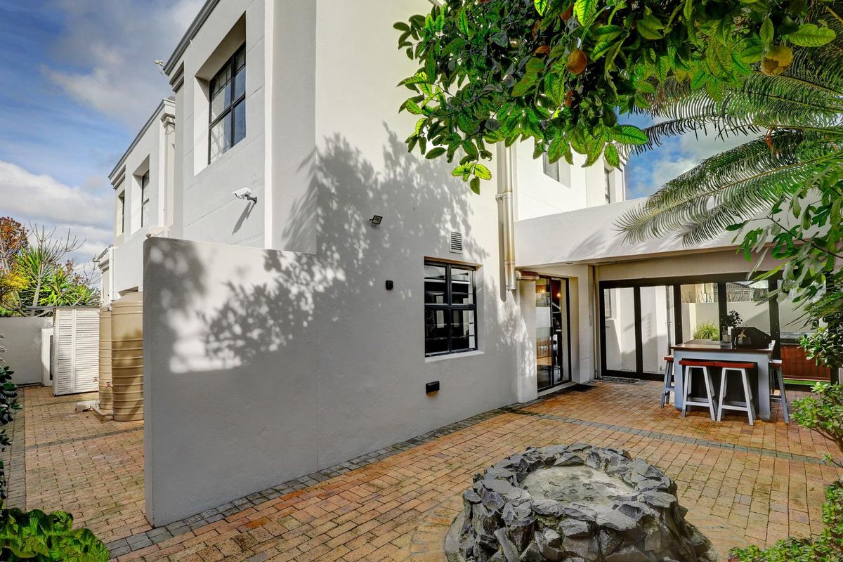 An exceptional opportunity to own a beautiful, modern home offering secure, stylish living in a sought-after, well-managed security estate! - Photo 4