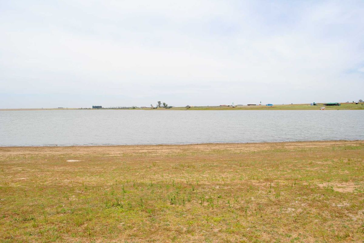 A scenic view of the waterfront on this agricultural land, featuring open grassy terrain leading to the water's edge.