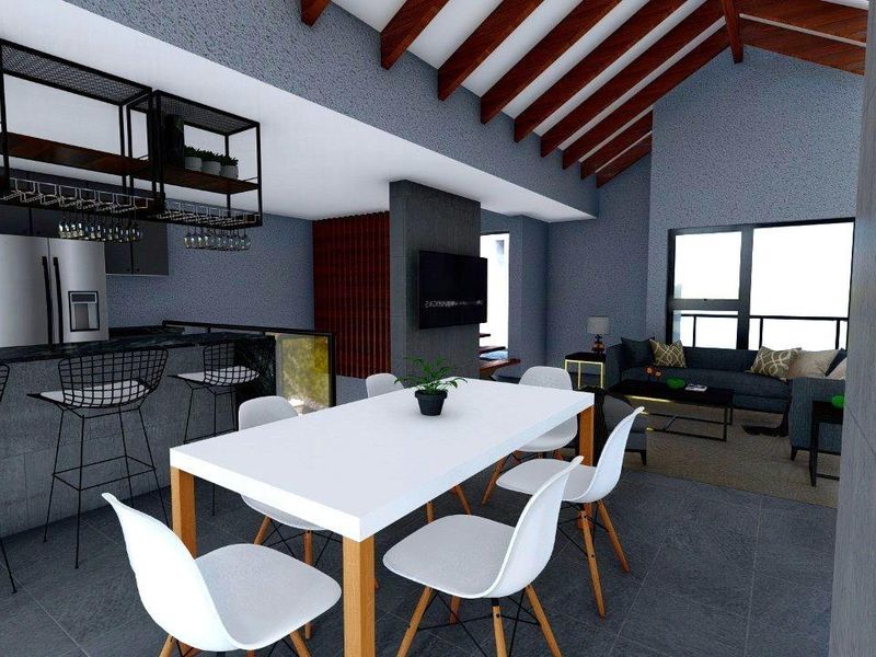 Modern open-plan living area featuring a vaulted ceiling with exposed timber rafters, a sleek kitchen island, and integrated dining space.