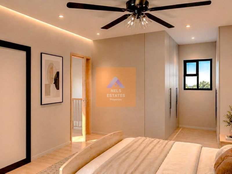Modern bedroom featuring a ceiling fan, recessed lighting, built-in wardrobes, and an en-suite bathroom with a sleek sliding door.