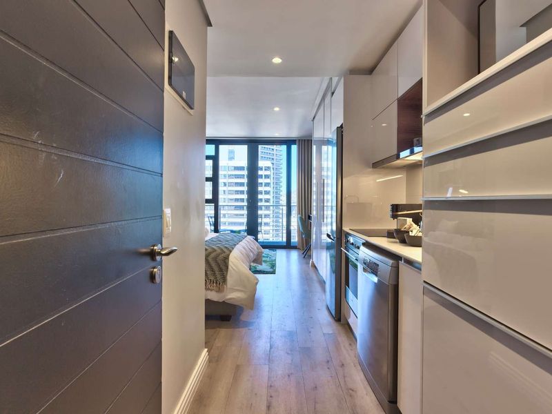 Elevated City Living | 16 On Bree Studio with Balcony | Pool & Views - Photo 10