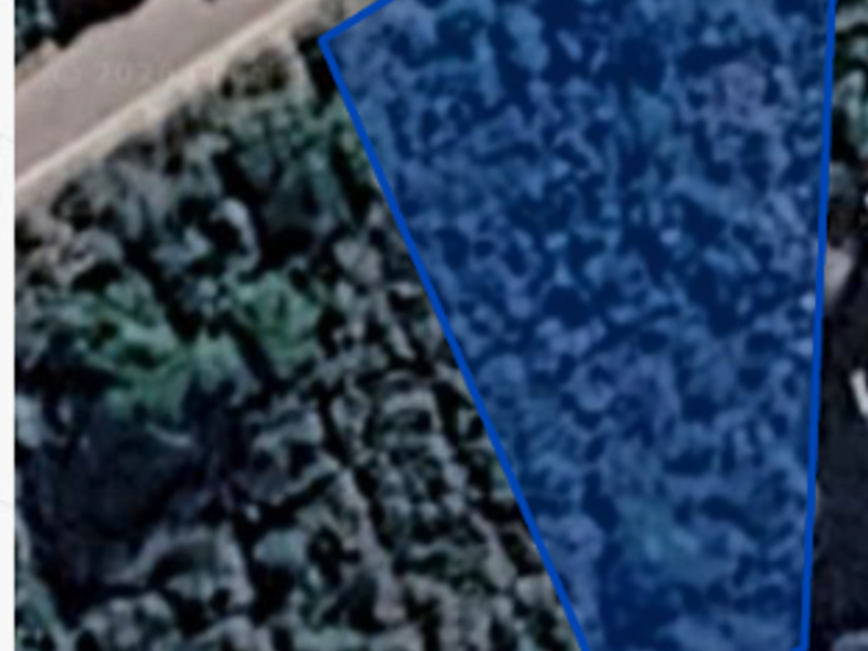 An aerial satellite view showing the boundaries of the vacant residential land plot.