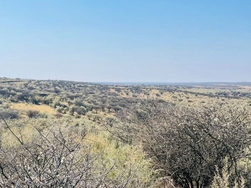 A wide-angle view of the natural landscape and surrounding bushveld terrain on the vacant residential property.