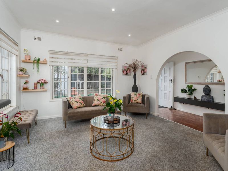 Delightfully spacious and loved family home adorned by lovely secure and established sunny garden plus built-in Braai area - this is a must see! - Photo 3
