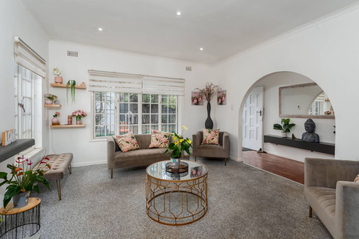 Delightfully spacious and loved family home adorned by lovely secure and established sunny garden plus built-in Braai area - this is a must see! - Photo 3