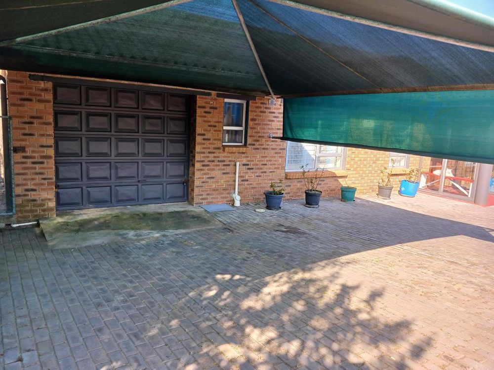 Single Garage - with double carport.