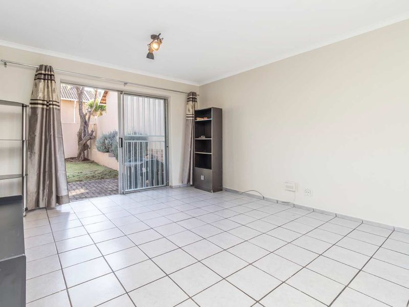 Spacious 1 Bedroom Townhouse with Expansive Private Garden | Sunrock Village Gem - Photo 2