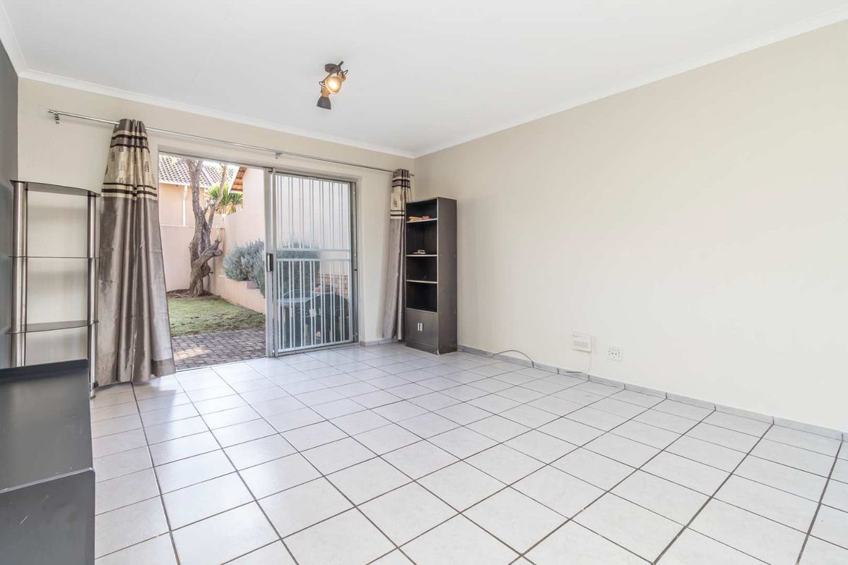 Spacious 1 Bedroom Townhouse with Expansive Private Garden | Sunrock Village Gem - Photo 2