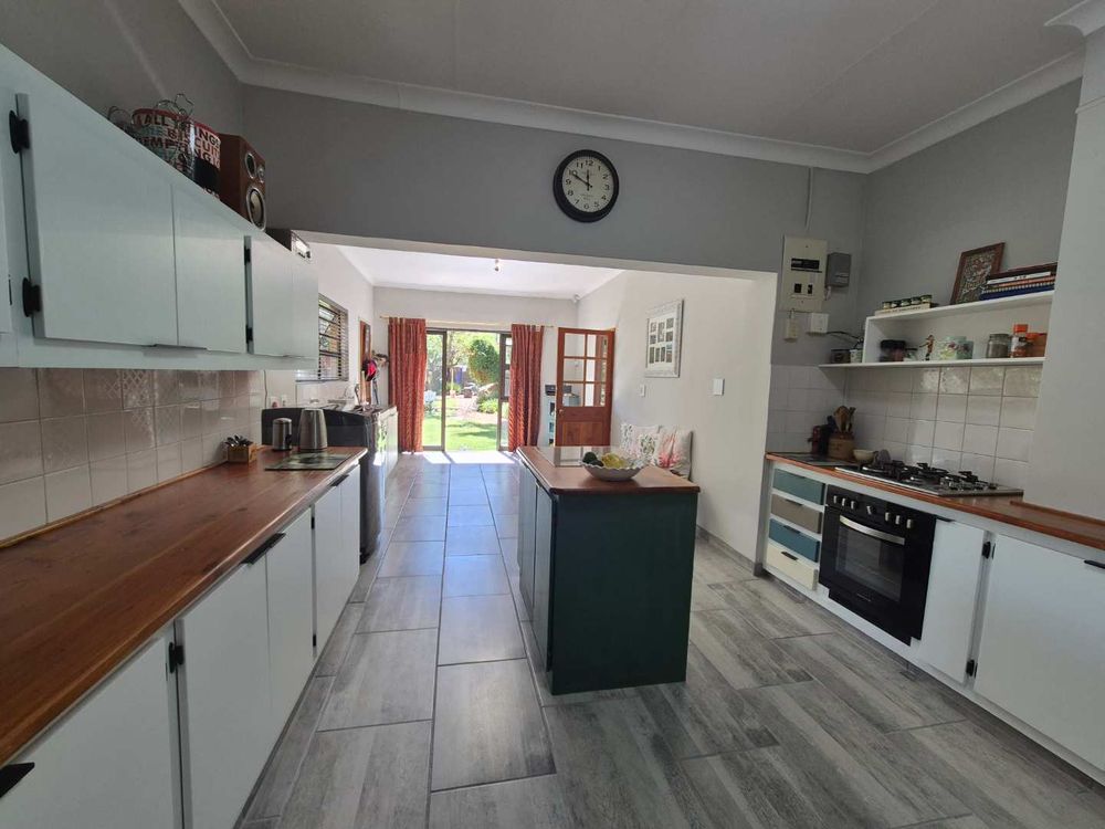 Spacious kitchen with doors to the back yard