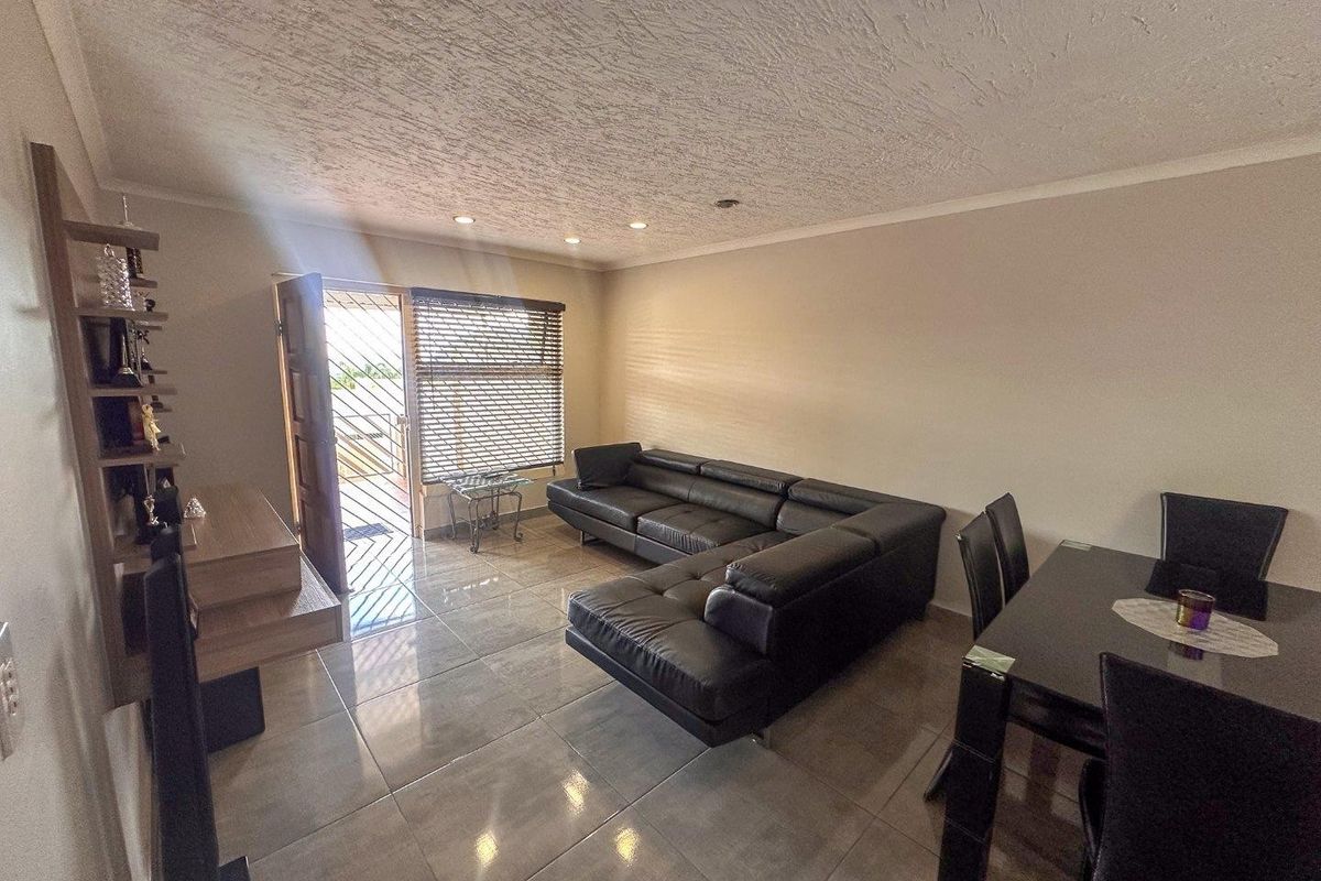 Modern 2-Bedroom Townhouse with Patio and Private Courtyard in Rangeview in Cosmos Complex - Photo 2