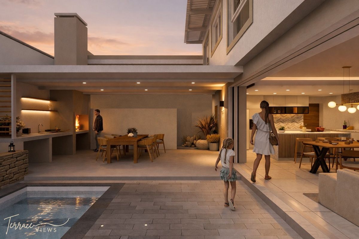 A modern open-plan living space featuring a seamless transition between the indoor kitchen and the covered outdoor patio with a built-in braai and pool.