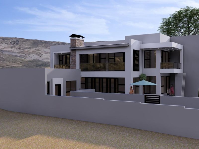 A modern two-story residential property featuring a stone chimney, glass-railed balconies, and a clean architectural design with a surrounding boundary wall.