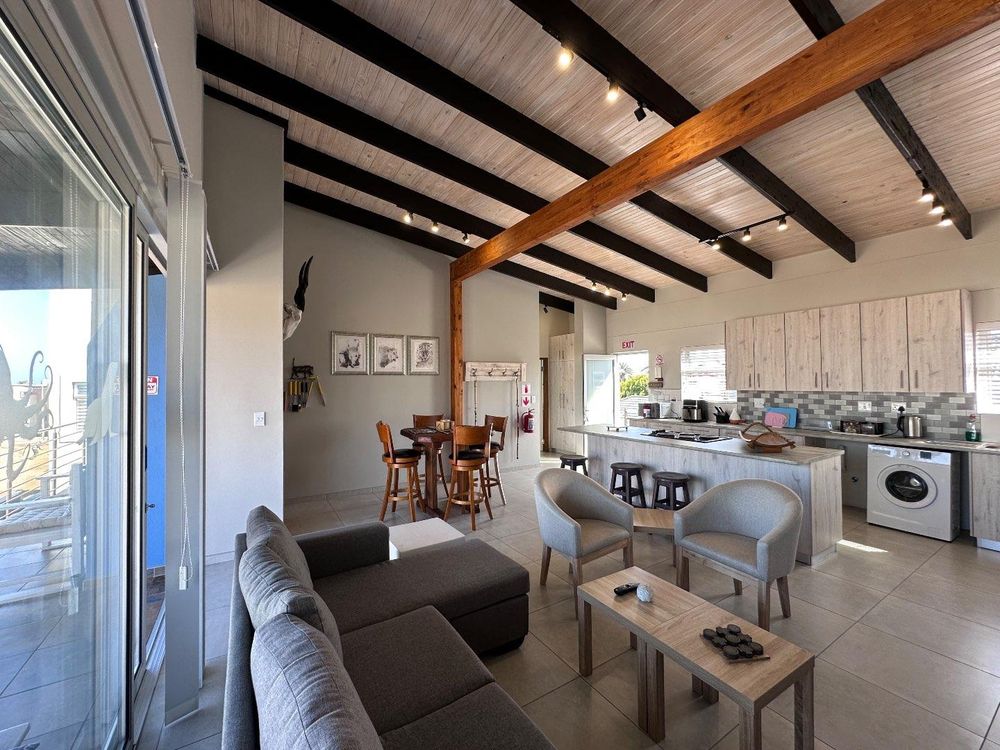 Main Flat, 2 ensuite bedrooms, open plan kitchen with lounge and inside barbecue and balcony.