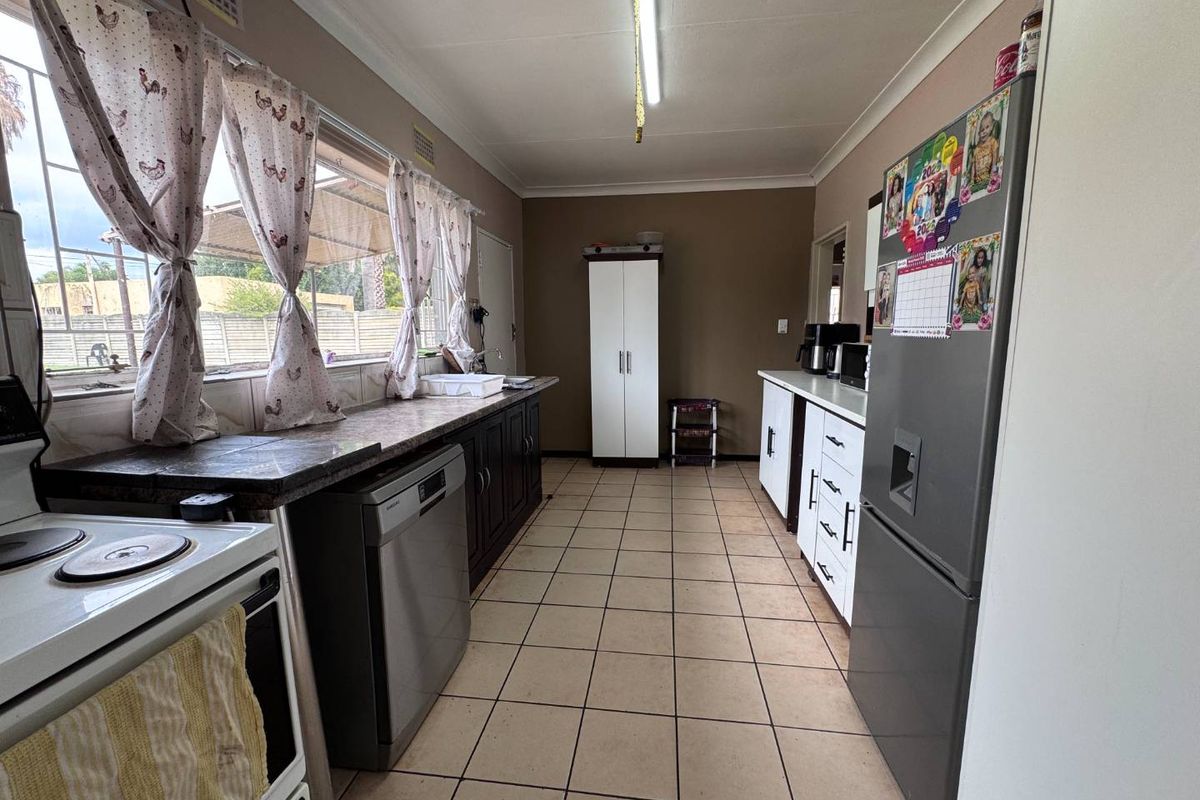 Unlock the Potential of this Spacious Family Home with Pool on a Large Stand - Photo 4