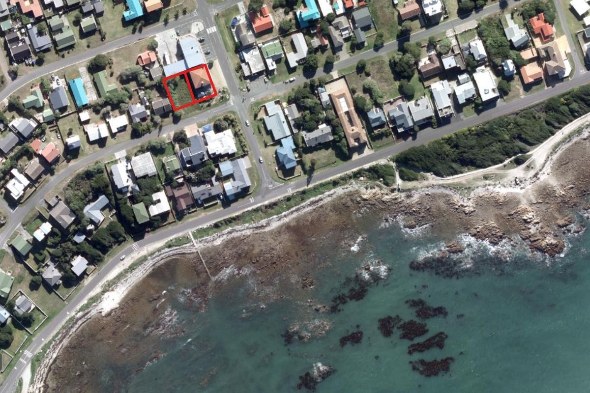 Aerial view of the coastal property location, highlighting the site boundaries within the surrounding residential and commercial neighbourhood.