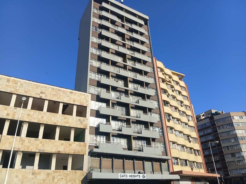 Exterior view of Cato Heights apartment building featuring a multi-story facade with individual balconies.
