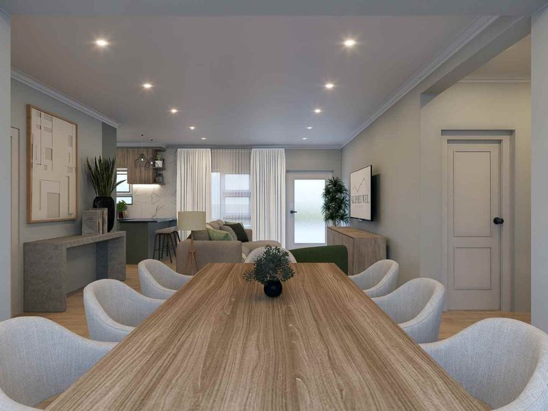 Modern open-plan living and dining area featuring recessed lighting, neutral finishes, and a seamless transition to a contemporary kitchen space.