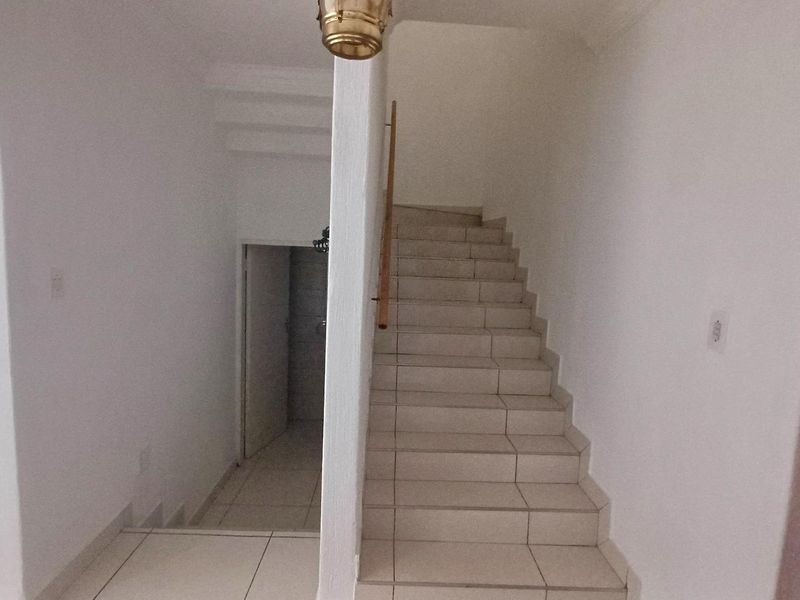 Spacious, Affordable Double-Storey Living with Patio & Pool - Photo 9