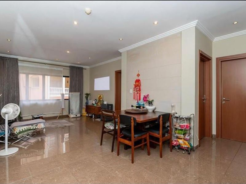 Open plan living and dining area featuring tiled flooring, recessed lighting, and neutral wall finishes.