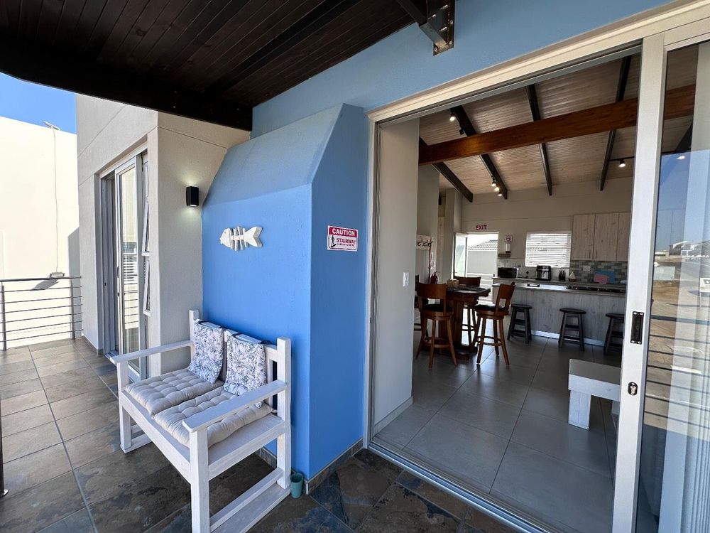 Main Flat, 2 ensuite bedrooms, open plan kitchen with lounge and inside barbecue and balcony.