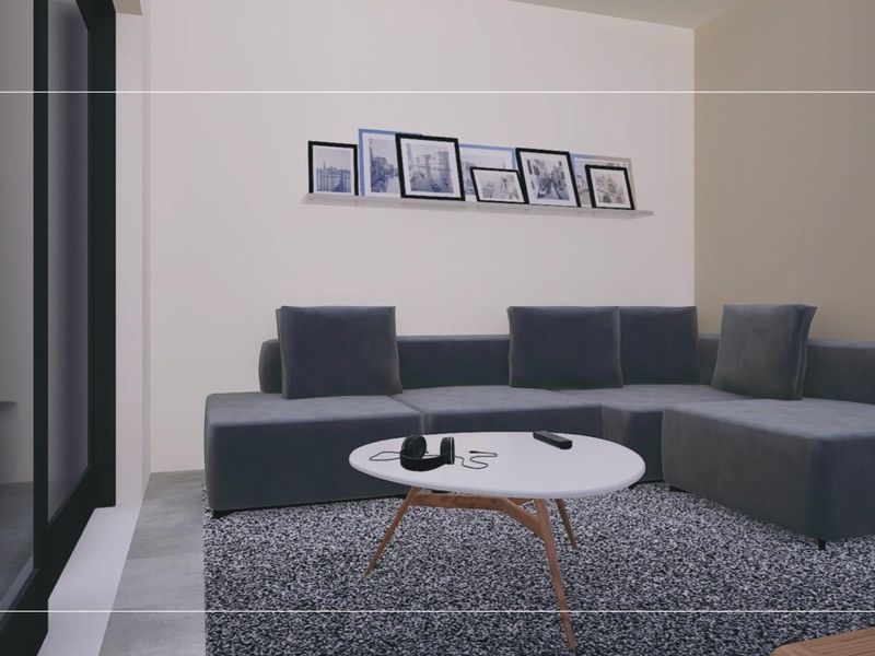 A modern living room interior featuring a large sliding glass door and neutral wall finishes.