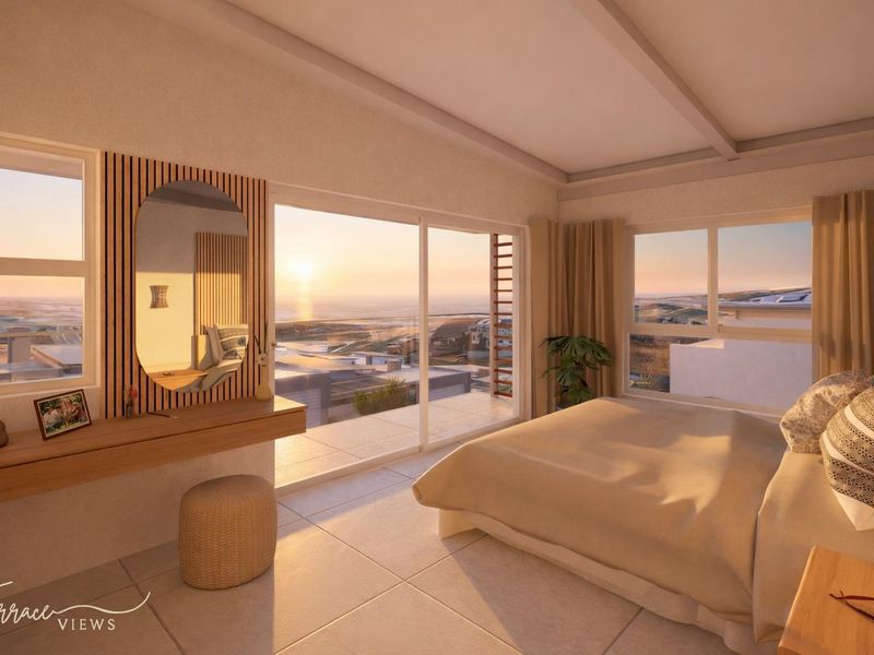 A modern bedroom featuring large sliding glass doors that open to a balcony with expansive ocean views and high-quality finishes.