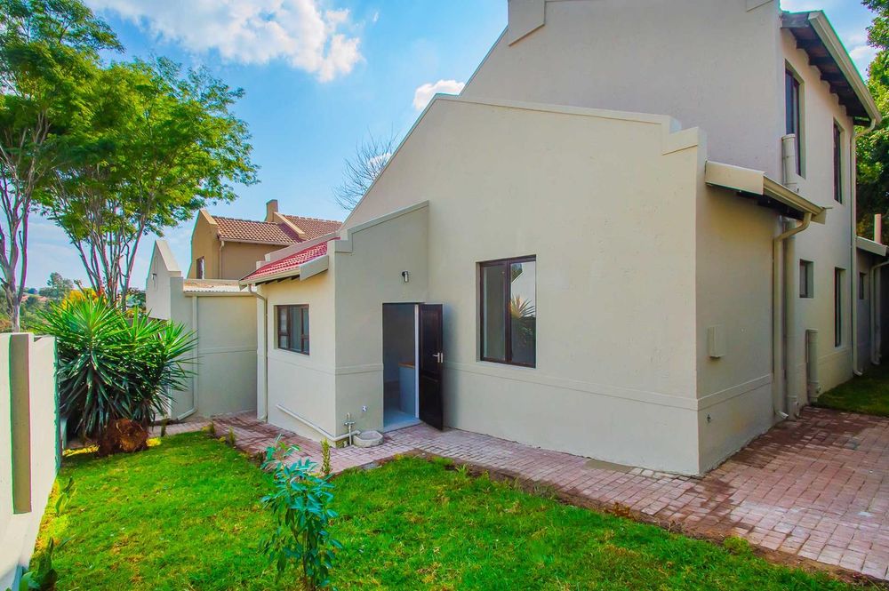 Exit from kitchen and wrap round garden 
