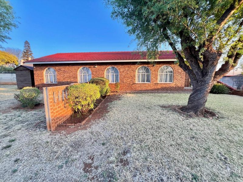 "Elegant Face Brick Home with Modern Security and Ample Parking! - Photo 9