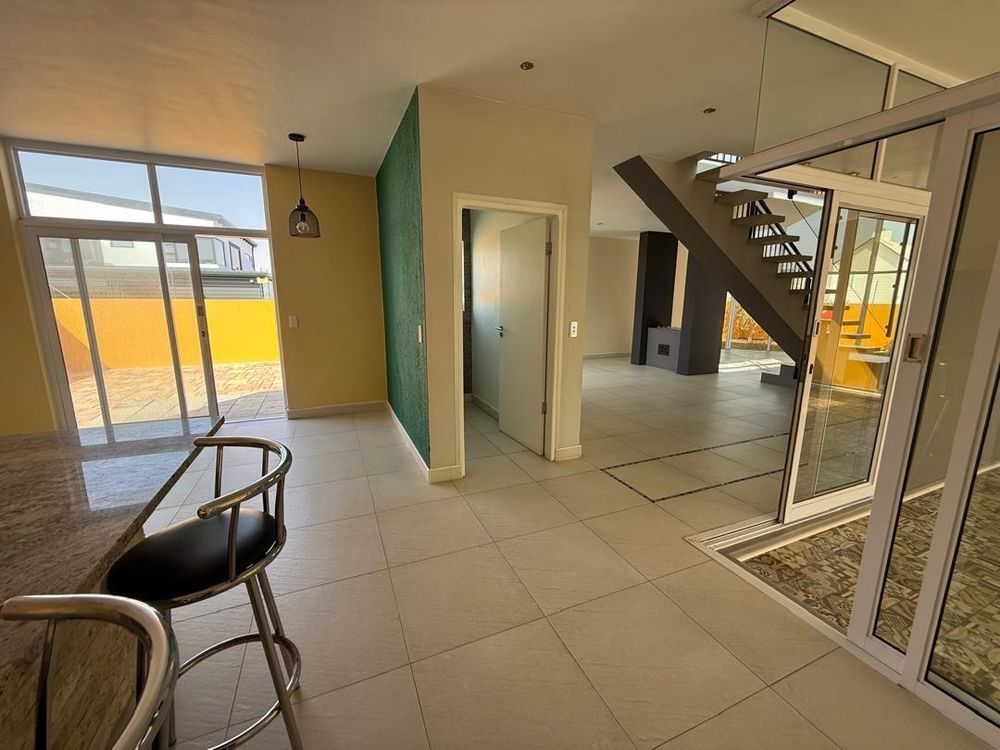 Entertainment area, guest WC and sliding door leading outside