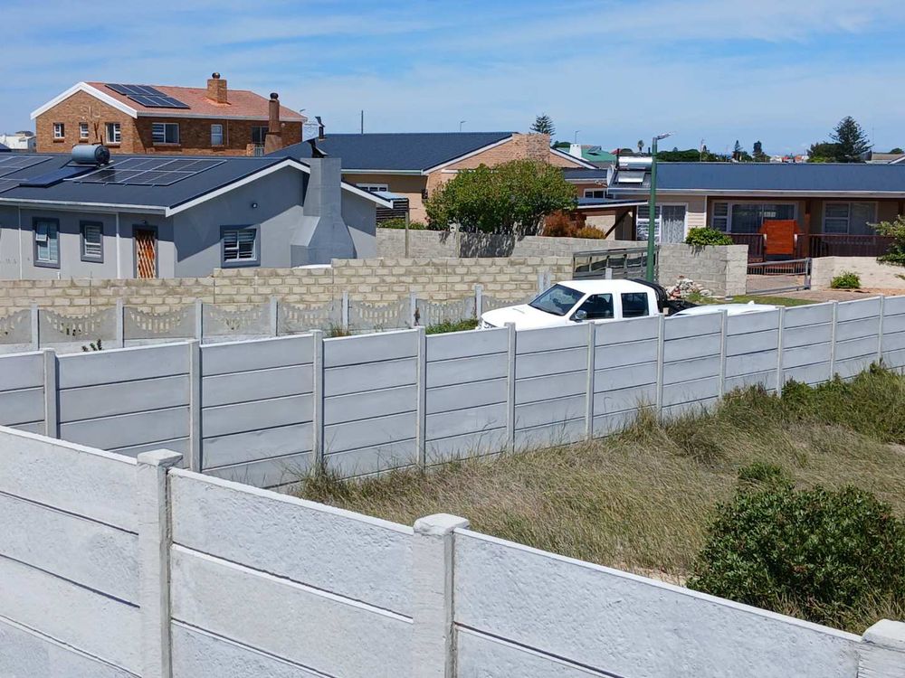 Our Plot in front of us - with Houses across cul-de-sac (in direction of the Mountain)