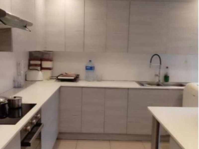 A functional kitchen featuring light wood-grain cabinetry, stone countertops, integrated appliances, and tiled flooring with recessed lighting.