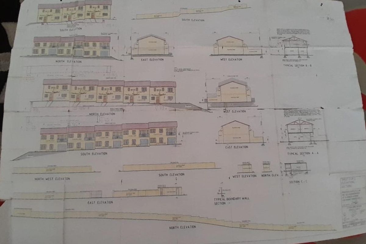 Architectural elevation and section drawings for a residential development project, detailing building facades and structural layouts.