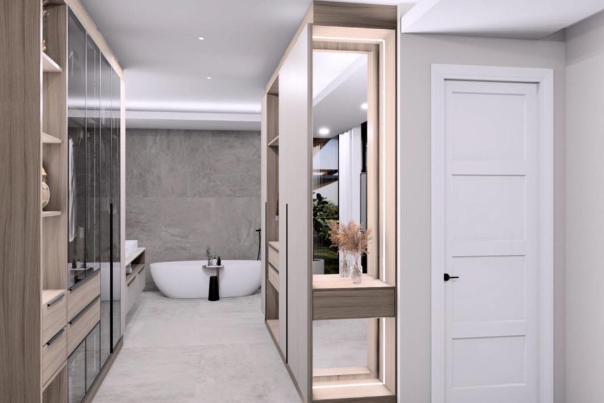 Modern luxury bathroom featuring a sleek freestanding bathtub, extensive built-in cabinetry, and high-end stone finishes with integrated ambient lighting.