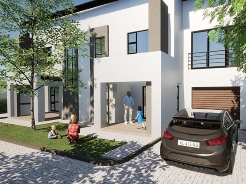A modern two-story residential facade featuring clean lines, a covered entrance porch, balcony, and integrated garage, set within a landscaped suburban environment.