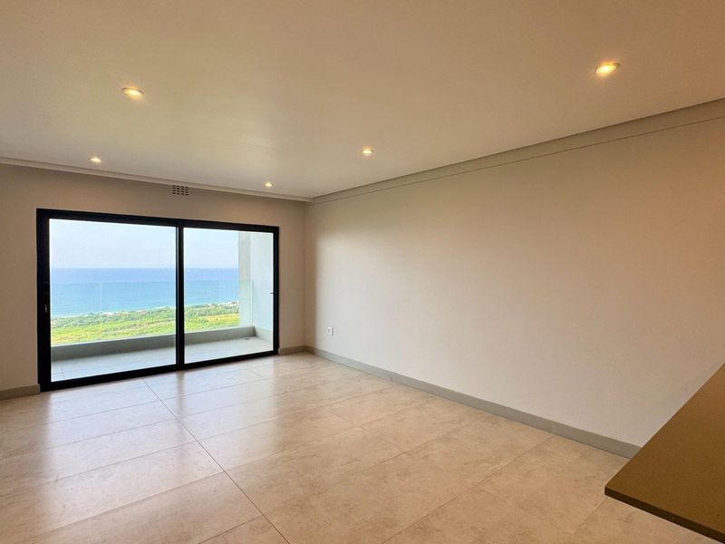 This brand-new, never-before-lived-in apartment offers a refined coastal lifestyle with breathtaking panoramic sea views and sleek, modern finishes throughout - Photo 5