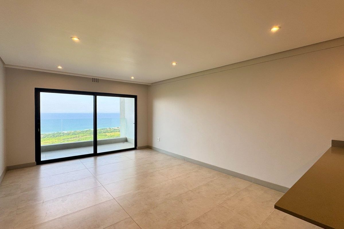 This brand-new, never-before-lived-in apartment offers a refined coastal lifestyle with breathtaking panoramic sea views and sleek, modern finishes throughout - Photo 5