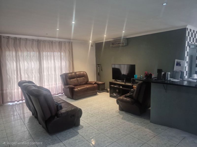 Open-plan living area featuring tiled flooring, recessed lighting, a split-system air conditioner, and a breakfast bar connecting to the kitchen space.