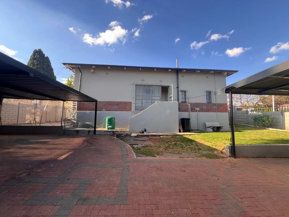 Back entrance to property with carports and two additional carports
