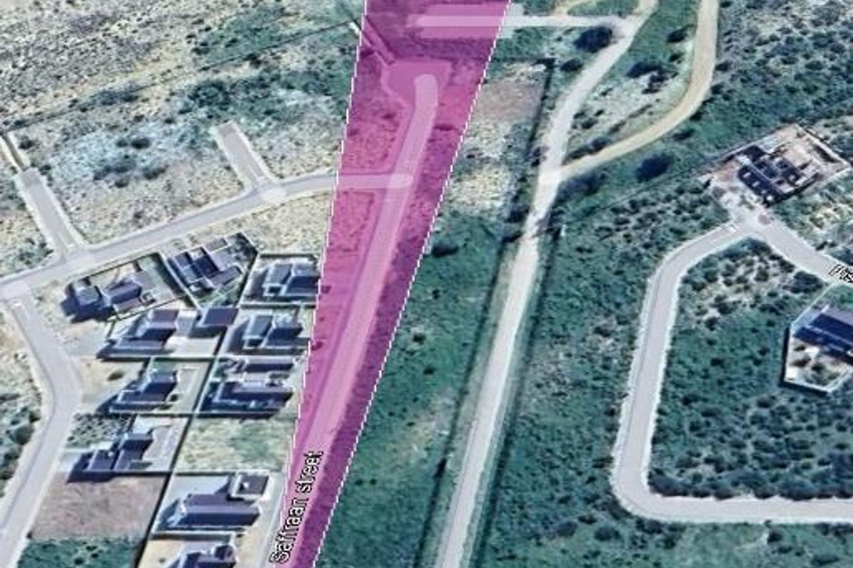 Aerial view of a vacant residential plot in Laaiplek, highlighting its proximity to the coastline and local street access.