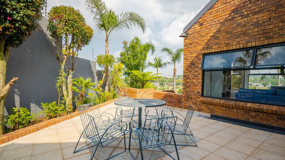 open seating area off dining room with a view over the valley