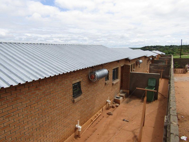 1 x 6 BEDROOM DOUBLE-STOREY HOUSE & 8 x 2 BEDROOM FLATS FOR SALE IN RUNDU: - Photo 9