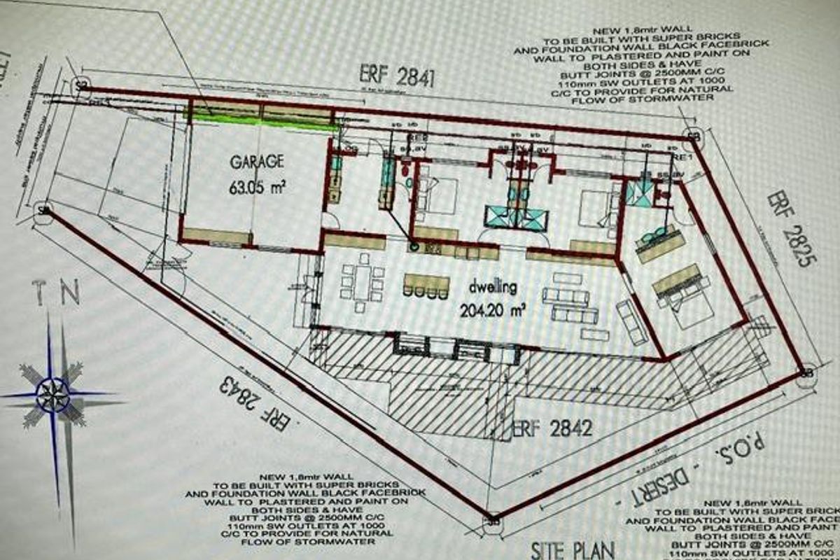 A detailed site plan and floor layout for the residential property, showing the dwelling footprint, garage, and boundary wall specifications.