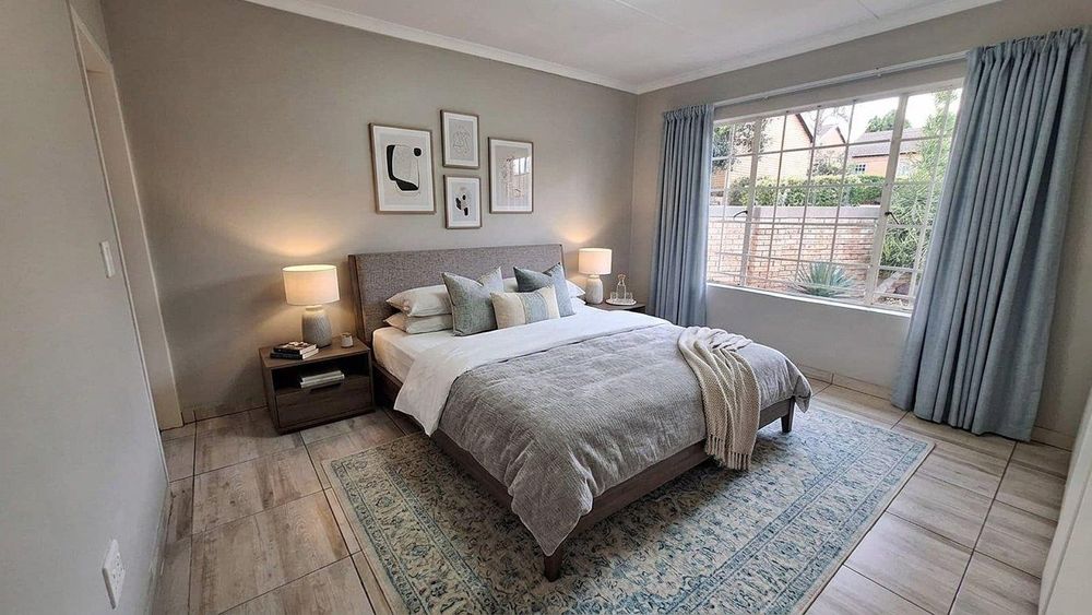 The master suite fits a king size extra length bed with ease. The furniture in this photo has been digitally staged using AI. 